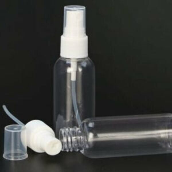 This is an image of Mini 30ml Portable Spray Bottles kept against a dark background.