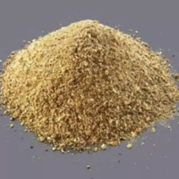 This is an image of finest Mustard Oil Cake Powder kept against grey color background.