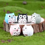 Miniature Owl Assorted on a log of wood.