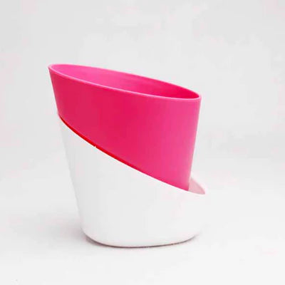 A pink oval self watering pot.