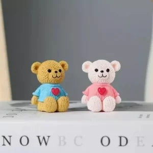 Set of two cute multi coloured teddy bears.