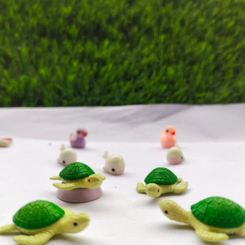 Multiple Miniature turtles facing each other.