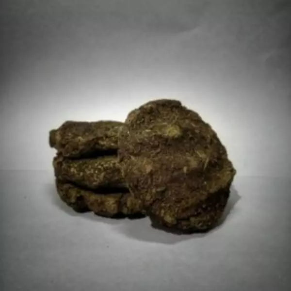 This is an image of Desi Mosquito Repellent Cow Dung Cake kept against grey color background.