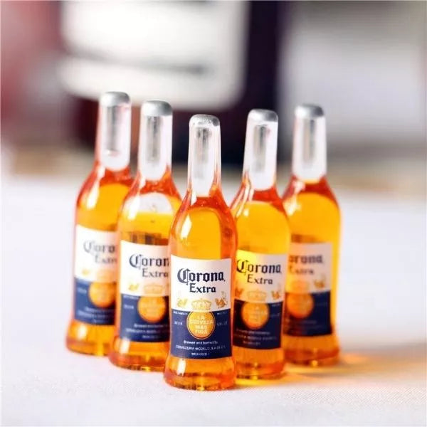 A Miniature Beer Bottles on a floor.