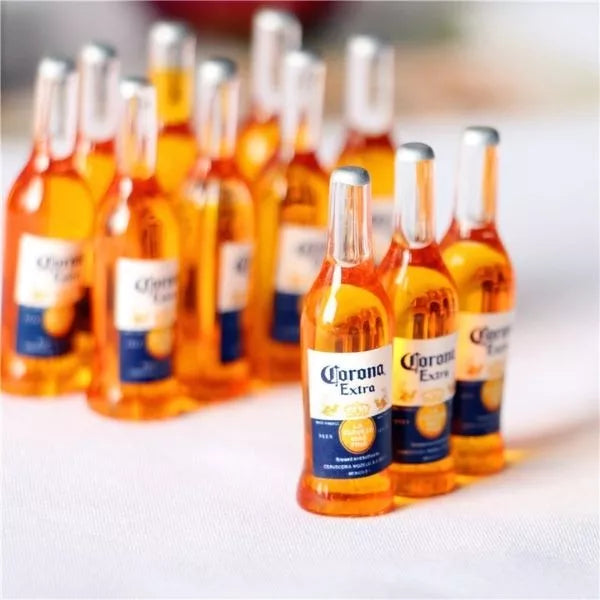 A Miniature Beer Bottles kept on a floor.