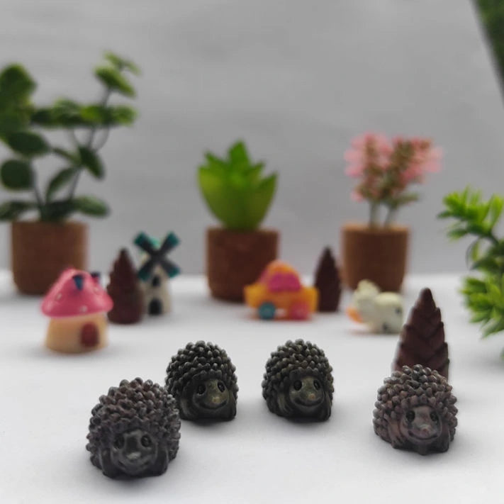 Small cute and different color Miniature Porcupine Long Nose on a white surface.
