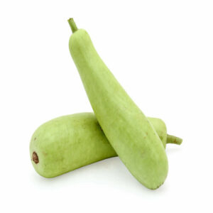 Several large cream white seeds of bottle gourd are kept against a white background