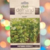 A packet of Demand Agro Celery Seeds kept against a colorful background.