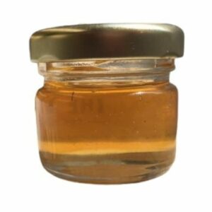 Multi floral honey in a clear jar with golden lid
