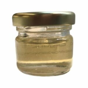 Raw White Honey kept in a small jar bottle