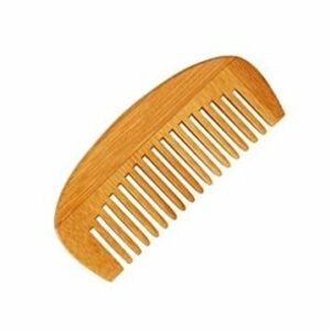 Neem wood comb kept against a white background