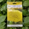 This is an image of a packet of Biocarve African Marigold F2 Yellow Seeds kept against green leafy background.