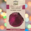 A packet of Demand Agro Red Cabbage F1 Hybrid Seeds kept against a colourful light background