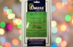 This is an image of a packet of Omaxe Imported English Lawn Grass kept against colorful background.