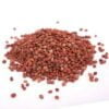 This is an image of several small round reddish-brown Radish seeds kept against white background.