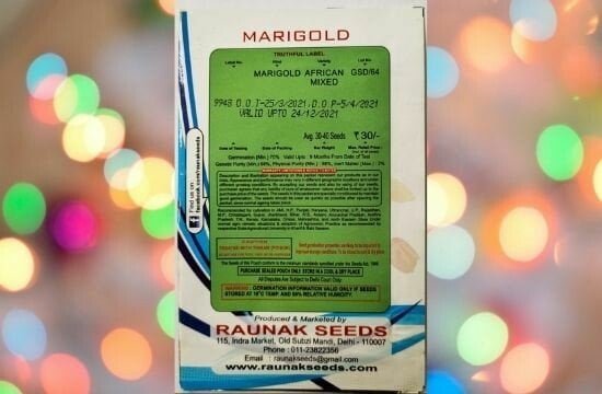 A packet of Raunak Seeds Marigold African Mixed Seeds in a colorful background