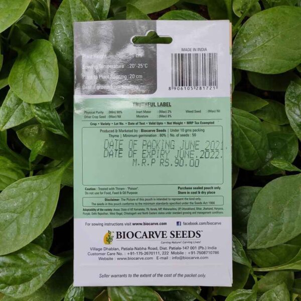 Backside picture of Biocarve Thyme Seeds packet with leaves in background