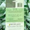 This is an image of the backside of a packet of Biocarve African Marigold F2 White Seeds kept against green leafy background.