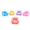 A cute multicolor Miniature Sofa/ Mini Sofa on a white floor.