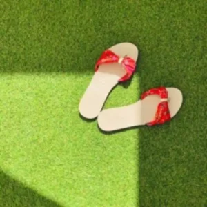 This is an image of Artificial Lawn Grass with a pair of sleeper on it.