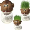 This is an image of three Wheat Grass Head Doll kept against white color background.