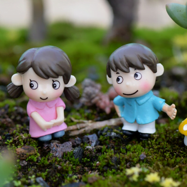 A cute Miniature Shy Couple on a rocky surface.