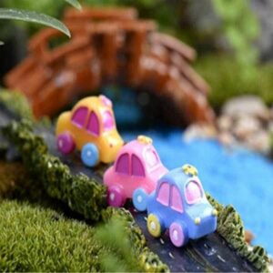A cute Miniature Toy Car on a mini garden.