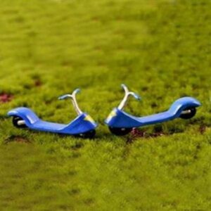 A cute two Miniature Toy Scooter facing each other on a grass.
