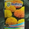 This is an image of packet of Indica Marigold African Mixed Seeds kept against a green leafy background.