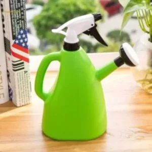 Green colored watering can sprayer kept on the table.