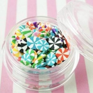 A multicolor Miniature Polymer Clay Candy in a glass bowl.