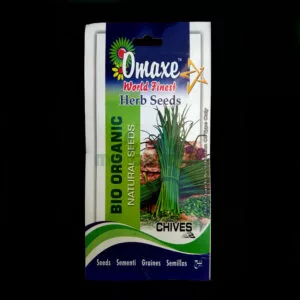 A packet of Omaxe Chives kept against a dark background.
