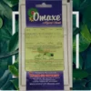 This is an image of the backside of a packet of Omaxe Mehendi Seeds with greenery in the background.