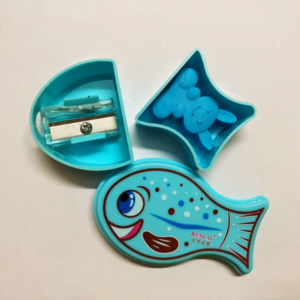 This is an image of blue color Fancy Fish Shape Sharpener and Rubber kept against light color background.