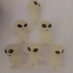 This is an image of multiple Glow in the Dark Elves against white color background.