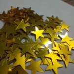 This is image of multiple Golden Sparkling Stars against white color background.