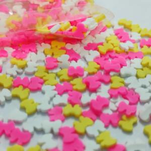 This is an image of multiple Miniature Polymer Clay Mixed butterfly in white, pink and yellow color.