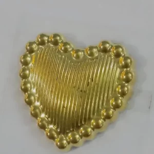 This is an image of Golden Heart Sticker against a grey color background.