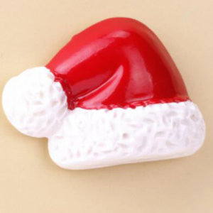 This is an image of Miniature Christmas Hat against a light pink color background.
