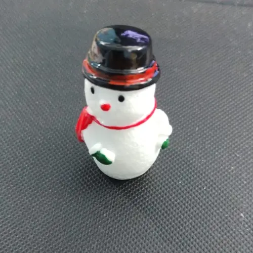 This is an image of the Miniature Snowmen against a black background.