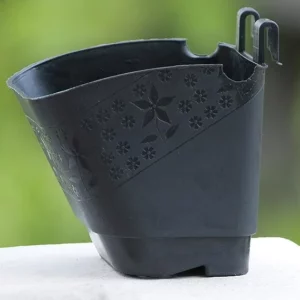 This is an image of a Vertical Wall Hanging Pot of black color kept against blur background.